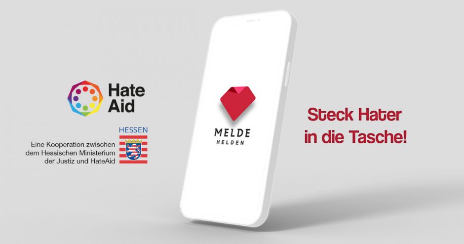Handy mit MeldeHelden Logo, den Logos von HateAid und dem Hessischen Ministerium der Justiz sowie dem Slogan Steck Hater in die Tasche